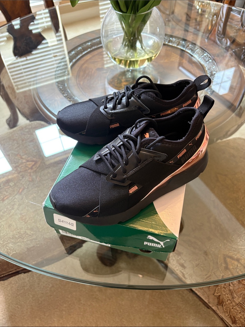 Puma women’s Black Sneakers with Rose Gold Accents